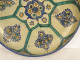 Large round polychrome earthenware dish with floral rosette, Morocco, Maghreb, Fez, late 19th century