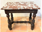 Small Louis XIII style office table in carved walnut with crimson marble top, 17th century