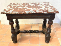 Small Louis XIII style office table in carved walnut with crimson marble top, 17th century