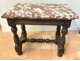 Small Louis XIII style office table in carved walnut with crimson marble top, 17th century