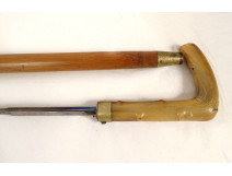 Sword cane with a Toledo-style damascened blade and horn pommel, wooden shaft, 19th century