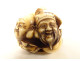 Carved ivory netsuke signed Tomochika, Noh masks, faces, Japan, Edo period, 19th century