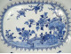 Octagonal porcelain dish, white and blue Chinese landscape with flowers, Qianlong period, 18th century