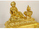 Pair of Louis XVI gilt bronze andirons with draped acanthus ram children, 18th century