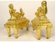 Pair of Louis XVI gilt bronze andirons with draped acanthus ram children, 18th century
