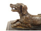 Bronze sculpture paperweight depicting a reclining hunting dog, black marble, 19th century