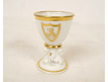 Empire porcelain egg cup, Paris, gilt decoration, busts of caryatids and sphinxes, 19th century