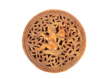 Small round corozo box carved with cherub musician, torch, and quiver, 19th century
