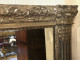 Trumeau mirror in carved wood with colonnettes and side panels, Consulate/Empire period, 18th-19th century