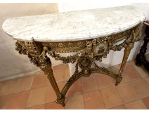Louis XVI half-moon console table in gilt wood with coat of arms, heraldic shield, flowers, and marble, 19th century