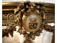 Louis XVI half-moon console table in gilt wood with coat of arms, heraldic shield, flowers, and marble, 19th century