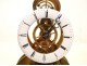 Skeleton clock and alarm unit fractions, under glass, in gilt brass nineteenth