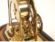 Skeleton clock and alarm unit fractions, under glass, in gilt brass nineteenth