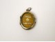 Reliquary, gilded medallion dedicated to Saint Louis de Montfort, ossibus, nineteenth