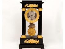 Columns blackened wood clock gilded bronze swans First Empire XIX crowns