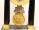 Columns blackened wood clock gilded bronze swans First Empire XIX crowns