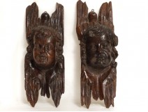 Pair sculptures heads angels cherubs carved panels seventeenth century