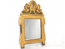 Miroir Louis XVI bois sculpté doré oiseaux carquois flambeau XVIIIè siècle